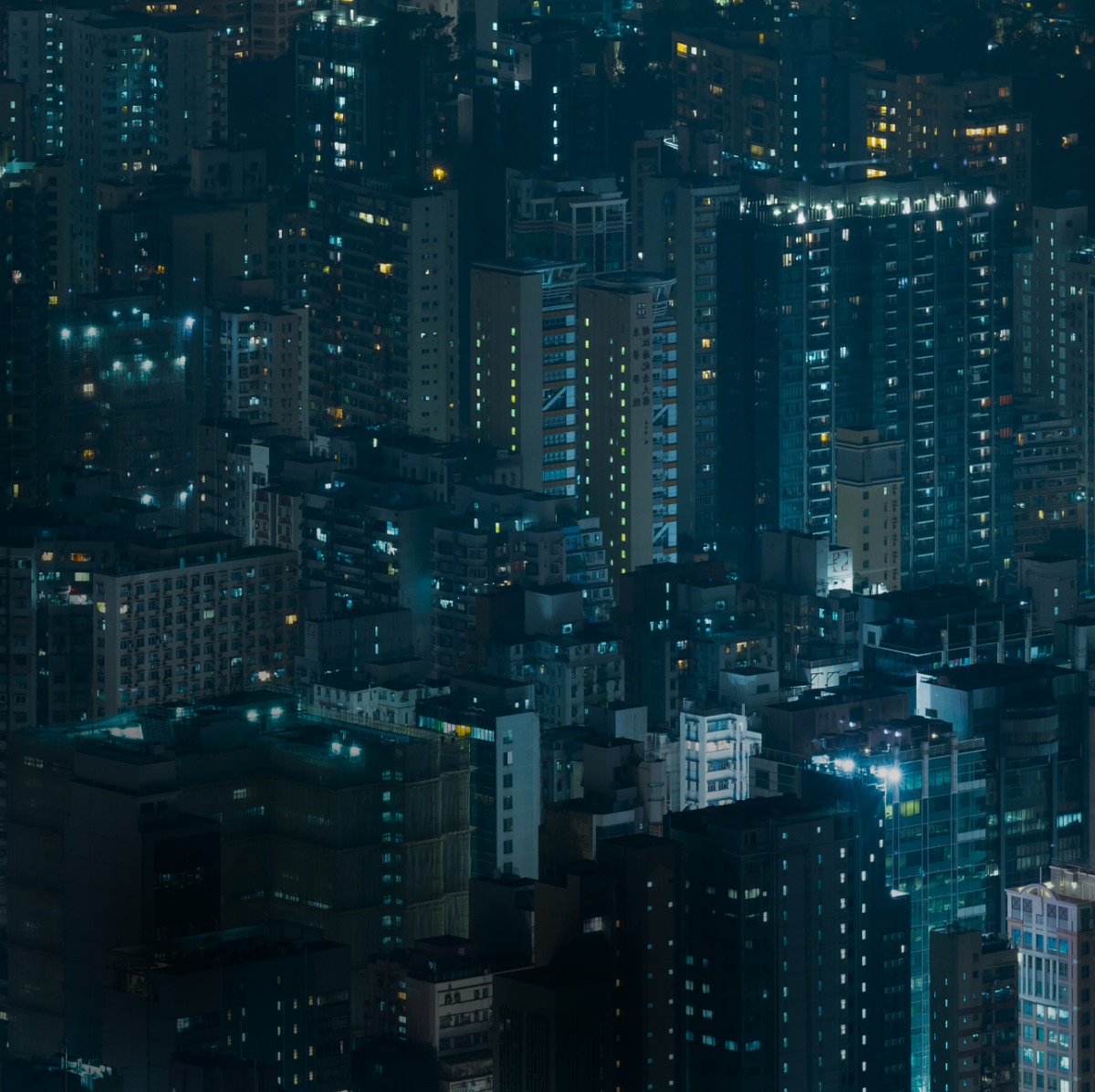 AI and the Next Phase of the Software Cycle Nighttime city skyline with illuminated high-rise buildings and office towers, representing the global software industry and digital infrastructure landscape analyzed by Apollo Global Management in the evolving AI-driven software cycle.